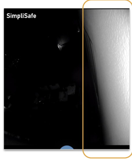 A camera's point of view where the white of the wall is washing out the rest of the imag