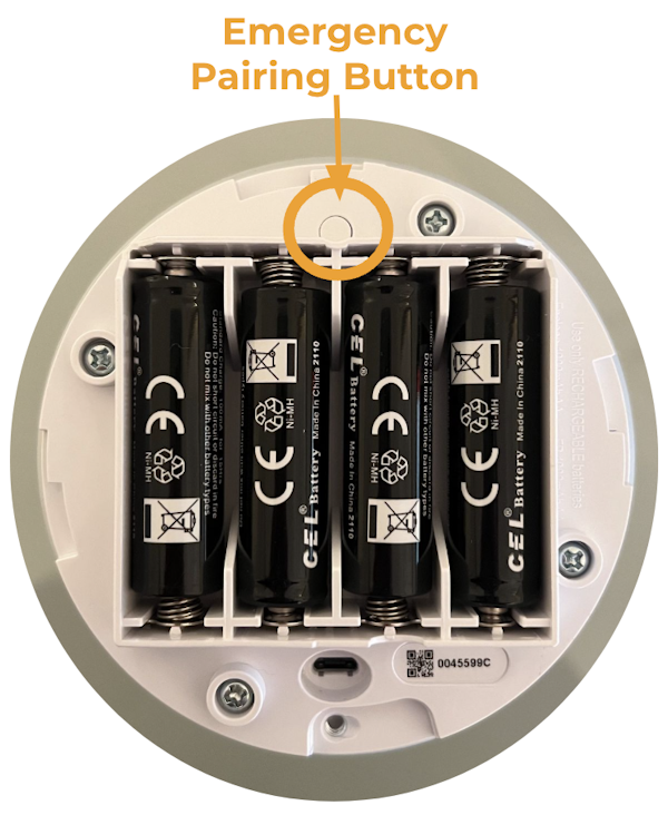 A circle highlighting the emergency pairing button above the battery compartment within the Base Station battery compartment.