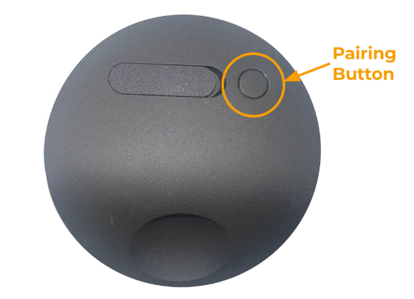 The back side of the Outdoor Camera Series 2 with a circle highlighting the pairing button which is to be pressed in these steps